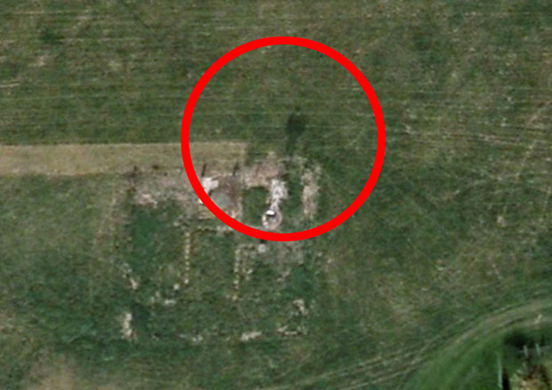 Ghost in a flat cap appears by village destroyed in 1946 on Goo-ghoul Earth 5