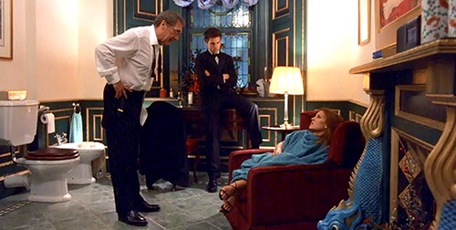 Bill finds Ziegler in his gigantic bathroom dressing up and an almost unconscious woman.