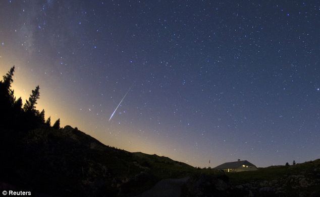 A meteor streaks past stars in the night sky at the Mont-Tendre near Montricher in the Jura