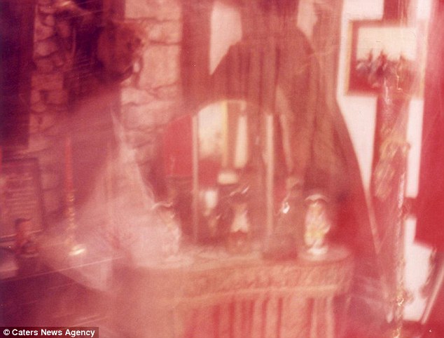 Spooky: This unedited picture captures a ghostly figure moving in the Bishop's room in Britain's most haunted B&B 