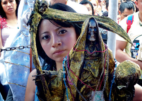 Girl holding a Saint Dead figure