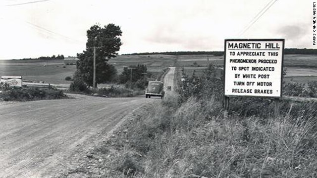Though ultimately an optical illusion and not a magnetic force, the sensation of rolling backward uphill without power on Magnetic Hill has drawn carloads of travelers to test this curiosity since it was discovered in the 1930s. This circa 1940 photo gives drivers instructions.