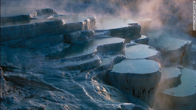 The frozen-looking landscape in Pamukkale, Turkey, is actually the result of calcium carbonate deposits from 17 natural hot springs accumulating over thousands of years. 