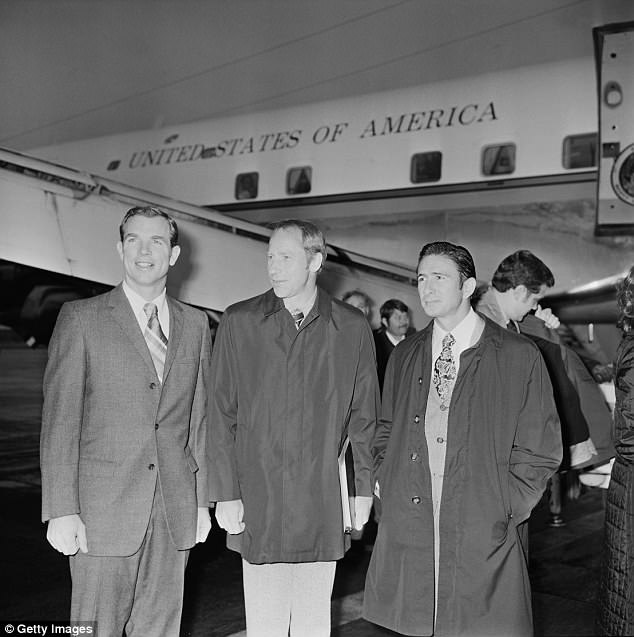 Experts claim their results prove they were 'completely convinced' that signs of alien life they claimed to have witnessed were genuine. Al Worden is pictured (center) next to astronauts David Scott (left) and James Irwin (right)