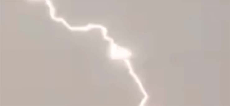 triangular UFO feeding the energy of lightning