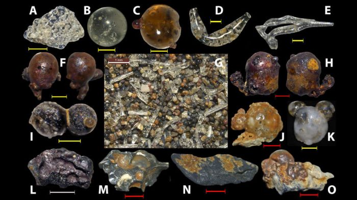 This assortment of glassy particles was discovered in beach sands near Hiroshima. (c) Anthropocene, Volume 25, March 2019
