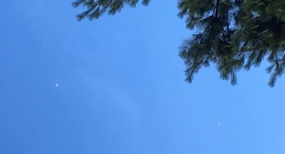 Mysterious floating White Orbs spotted in Kansas City sky 1