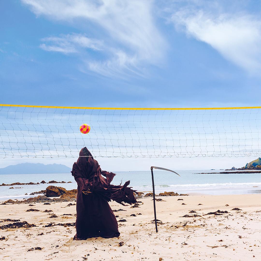 Beach volleyball with the Grim Reaper