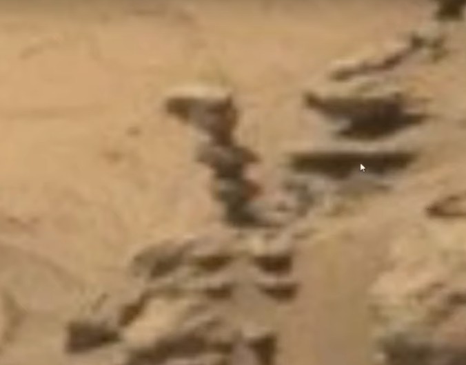 Rover Curiosity photographs an "Alien Statue" on the red planet 12