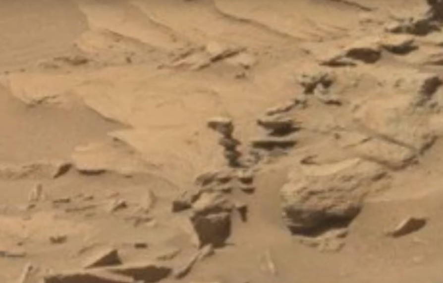 Rover Curiosity photographs an "Alien Statue" on the red planet 10