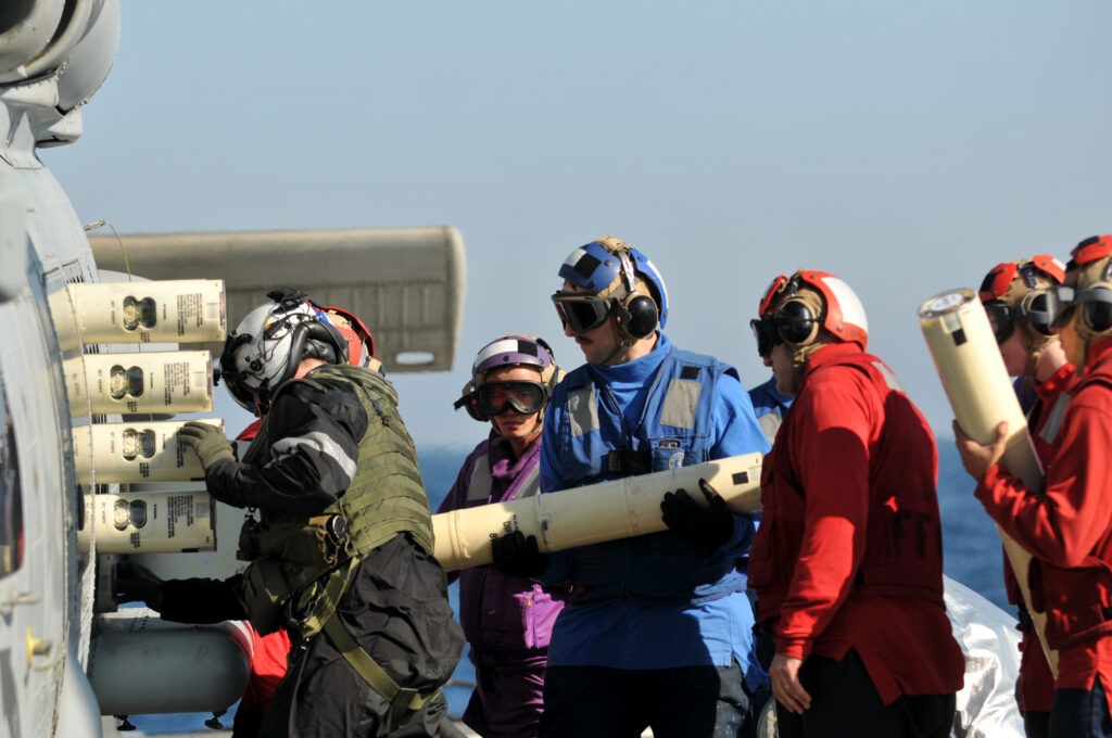 Loading of sonar buoys into SH-60B Sea Hawk helicopter. Such devices can be dropped from almost any type of equipment - an airplane, helicopter, drone, ship or boat. They transmit information about the surrounding acoustic situation on a single frequency and any combat unit equipped with a suitable receiver can receive this intelligence / © US Navy photo by Mass Communication Specialist 3rd Class Stuart Phillips