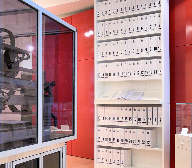 A cabinet with fragments of the human genome, stands in London's Wellcome Collection.  The complete transcript takes hundreds of volumes, each with thousands of pages.